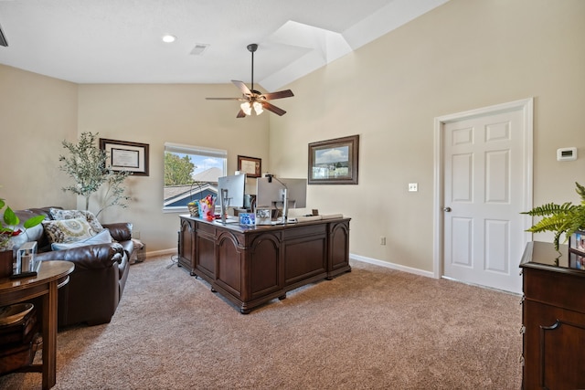 office area featuring visible vents, light colored carpet, baseboards, high vaulted ceiling, and ceiling fan