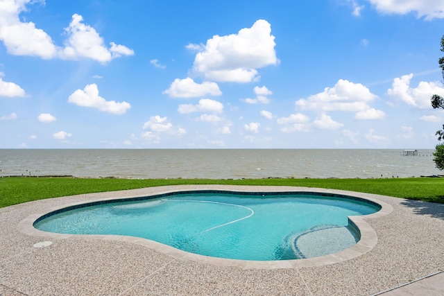 outdoor pool with a water view