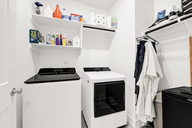 laundry room featuring washer and dryer and laundry area
