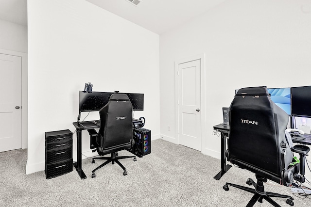 carpeted office featuring baseboards