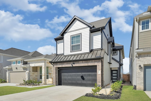 view of front of home with an attached garage, a standing seam roof, driveway, and brick siding