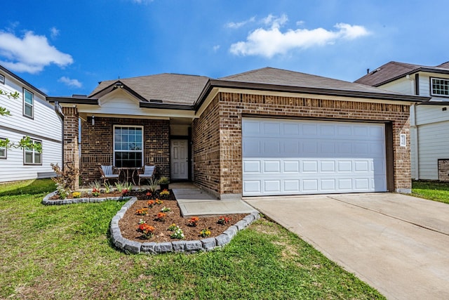 view of front of house with brick siding, a front lawn, a garage, and concrete driveway