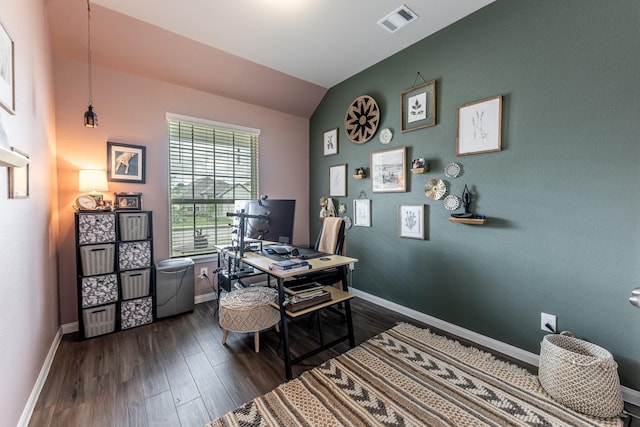 home office featuring baseboards, vaulted ceiling, visible vents, and dark wood-style floors