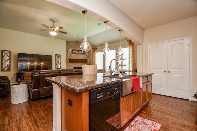 kitchen with a sink, open floor plan, ceiling fan, dark wood-type flooring, and black dishwasher