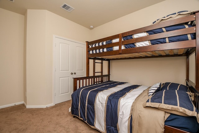 bedroom featuring baseboards, visible vents, and carpet flooring