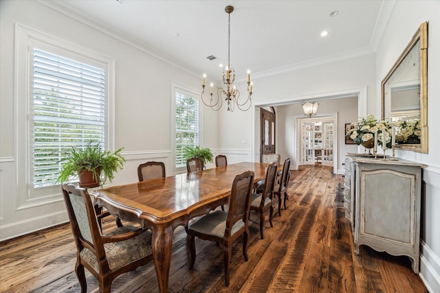 dining space featuring a chandelier, dark wood-style flooring, ornamental molding, and recessed lighting