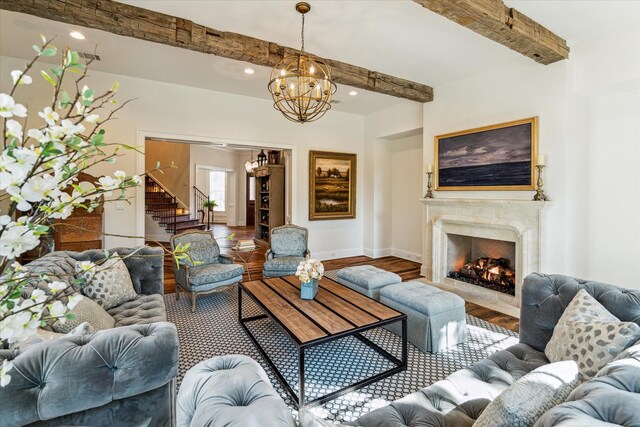 living area featuring stairs, beam ceiling, wood finished floors, recessed lighting, and baseboards
