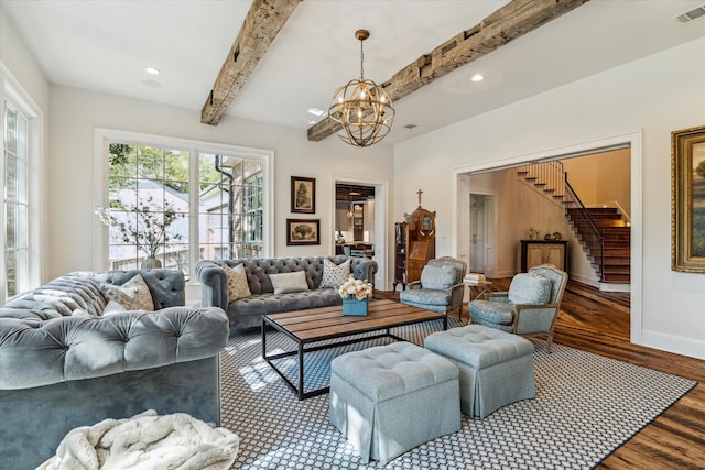living room with wood finished floors, beamed ceiling, a chandelier, stairs, and baseboards