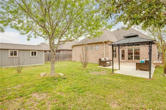 view of yard with a fenced backyard, an outdoor structure, a gazebo, and a patio