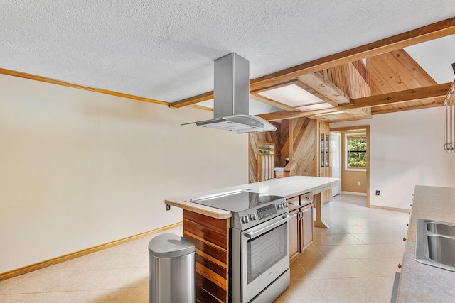 kitchen with a center island, stainless steel electric range, baseboards, island range hood, and light countertops