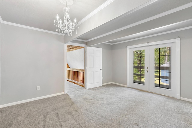 carpeted spare room featuring baseboards, a notable chandelier, french doors, and crown molding