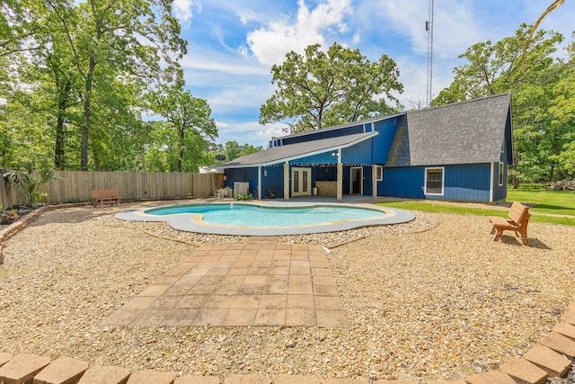 view of swimming pool with fence, a patio area, and a fenced in pool