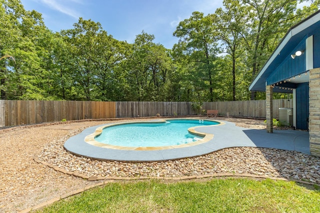 view of pool featuring a fenced in pool, a patio area, central AC, and a fenced backyard