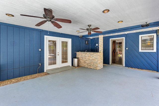 view of patio featuring a ceiling fan and french doors