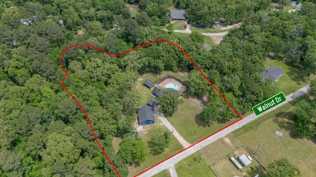 aerial view featuring a wooded view