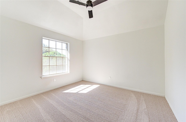 unfurnished room with lofted ceiling, a ceiling fan, baseboards, and carpet floors