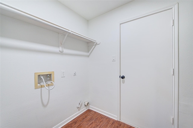 clothes washing area with electric dryer hookup, laundry area, baseboards, dark wood-style floors, and washer hookup