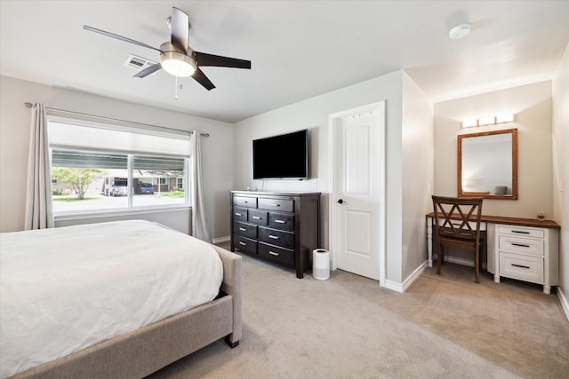 bedroom with baseboards, visible vents, light colored carpet, and ceiling fan
