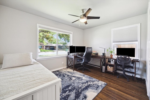 bedroom with wood finished floors, a ceiling fan, and baseboards