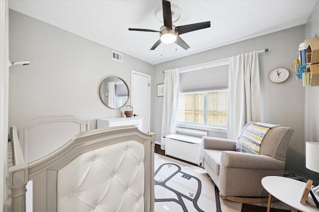 bedroom featuring a ceiling fan and visible vents