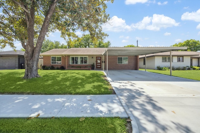 ranch-style house with brick siding, a front lawn, concrete driveway, and an attached carport