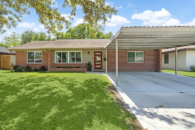 ranch-style home featuring concrete driveway, a front lawn, and brick siding