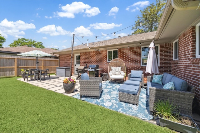 view of patio featuring fence, a grill, and an outdoor hangout area