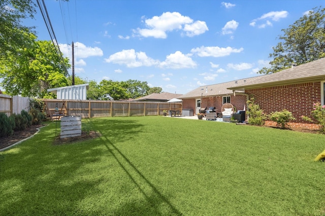 view of yard featuring a fenced backyard and a patio area