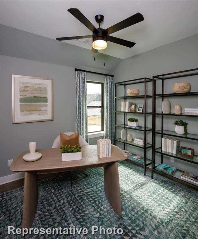 home office featuring wood finished floors, a ceiling fan, baseboards, and lofted ceiling