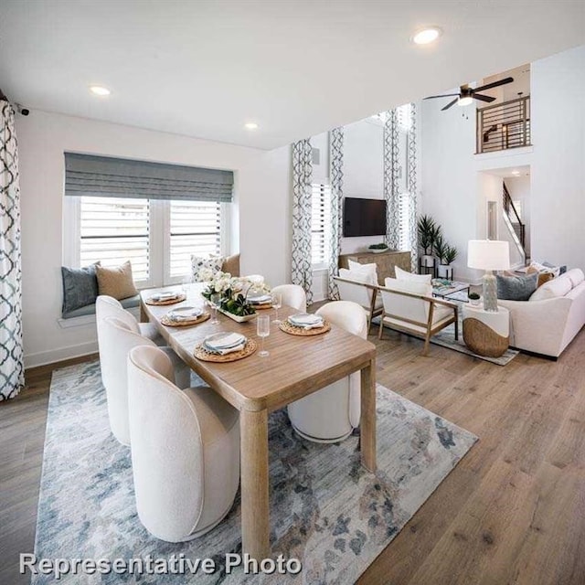 dining space featuring recessed lighting, wood finished floors, baseboards, and ceiling fan