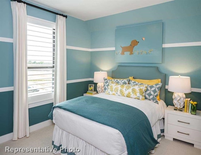 bedroom featuring carpet flooring, baseboards, and multiple windows
