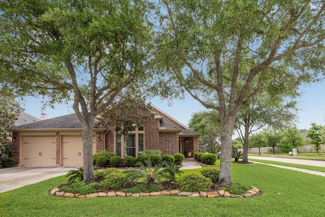 6315 Teal Mist Ln, Fulshear, TX 77441 - traditional-style house featuring a garage, fence, a front yard, brick siding, and driveway