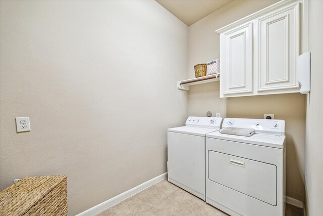 6315 Teal Mist Ln, Fulshear, TX 77441 - laundry room featuring separate washer and dryer, baseboards, and cabinet space