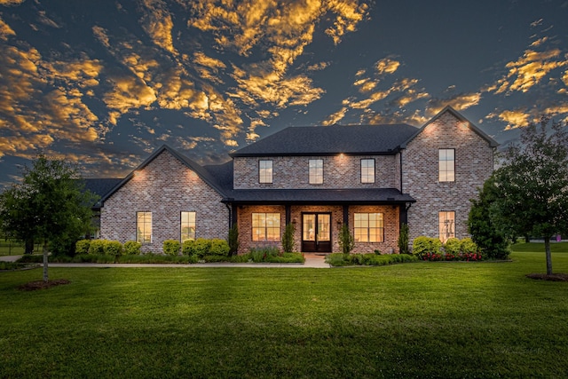8603 Lofty Pnes, Richmond, TX 77406 - traditional-style house with french doors, brick siding, and a yard