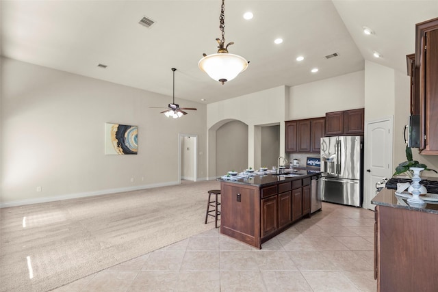 1846 Majestic Falls Ln, Richmond, TX 77469 - kitchen featuring arched walkways, visible vents, a sink, and appliances with stainless steel finishes