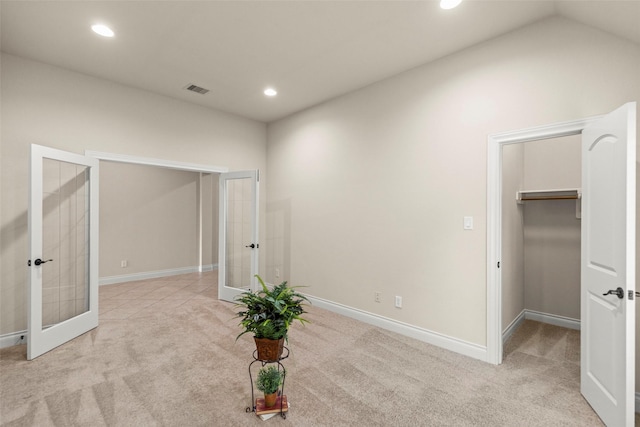 1846 Majestic Falls Ln, Richmond, TX 77469 - unfurnished bedroom with a spacious closet, french doors, visible vents, and carpet