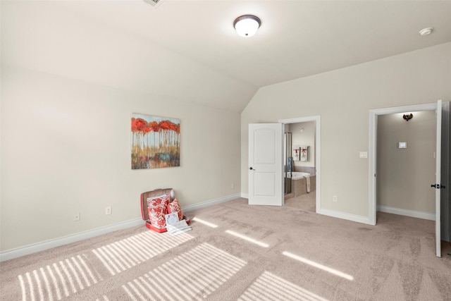 1846 Majestic Falls Ln, Richmond, TX 77469 - unfurnished bedroom featuring baseboards, lofted ceiling, light colored carpet, and ensuite bathroom