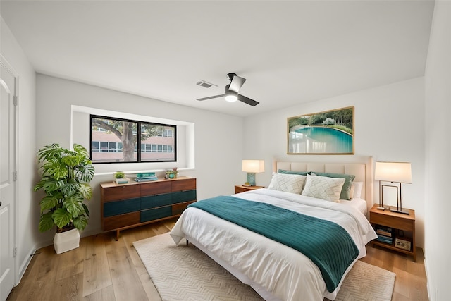bedroom featuring light wood-type flooring and ceiling fan