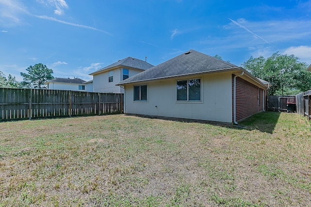 6626 Rusty Ridge Ln, Katy, TX 77449 - rear view of house featuring a lawn and a fenced backyard