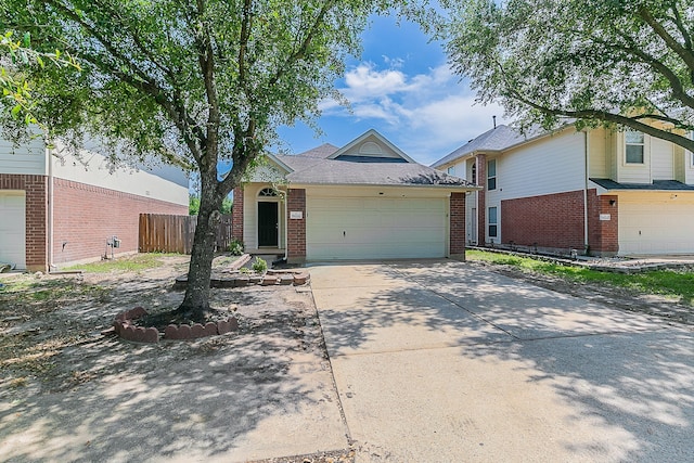 6626 Rusty Ridge Ln, Katy, TX 77449 - ranch-style home featuring fence, driveway, brick siding, and a garage