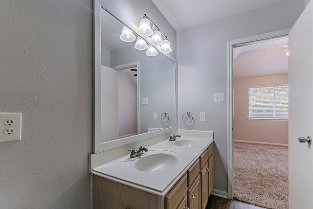 6626 Rusty Ridge Ln, Katy, TX 77449 - bathroom featuring baseboards, a sink, and double vanity