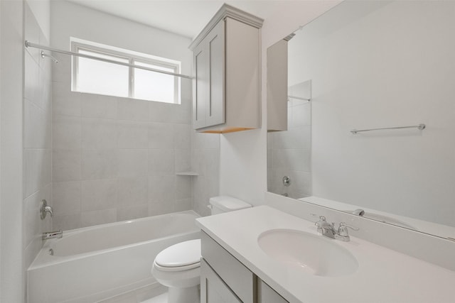 bathroom with toilet, vanity, and tub / shower combination