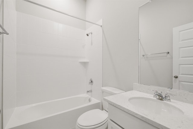 bathroom featuring toilet, vanity, and bathtub / shower combination