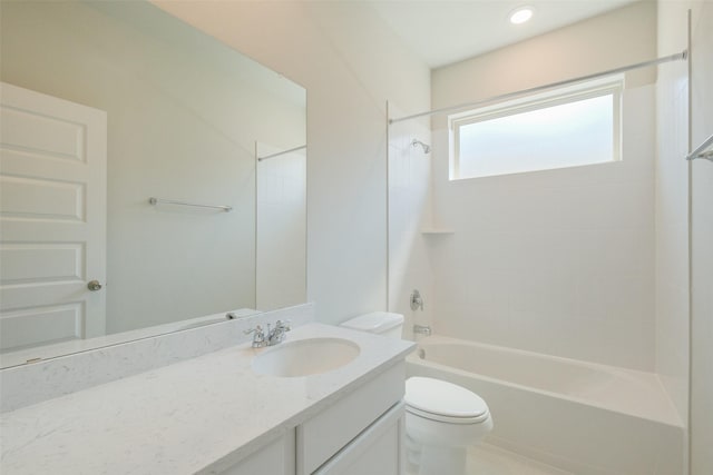 bathroom with shower / washtub combination, vanity, and toilet