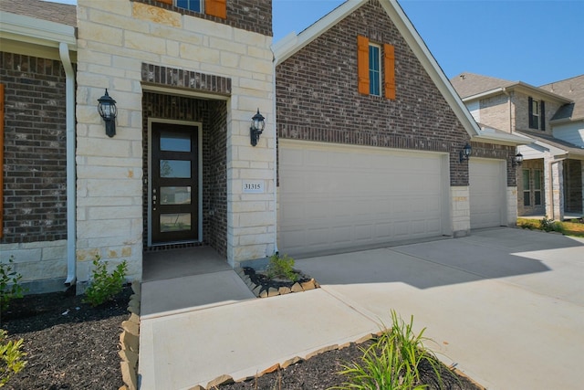 exterior space with driveway and stone siding
