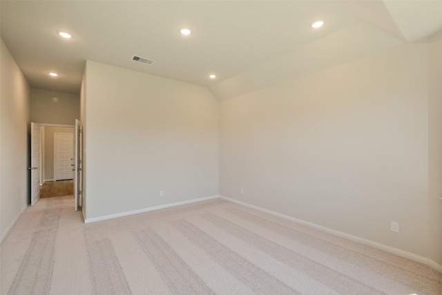 spare room with baseboards, light carpet, visible vents, and recessed lighting