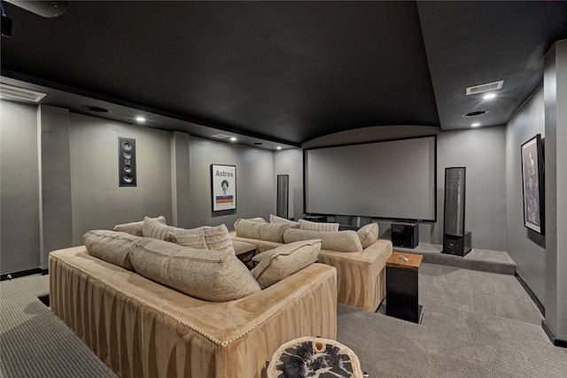 carpeted cinema room featuring lofted ceiling, baseboards, visible vents, and recessed lighting