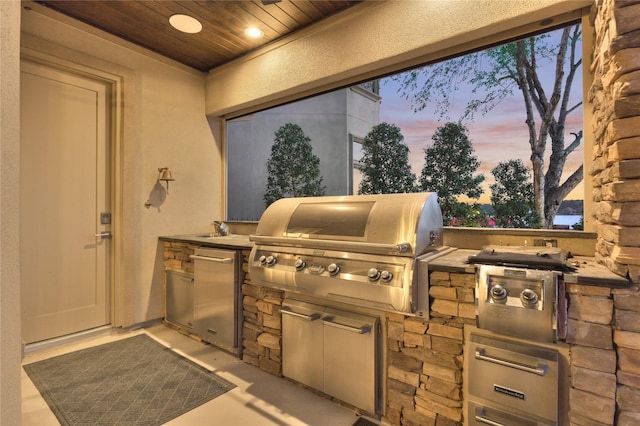 view of patio featuring exterior kitchen and grilling area