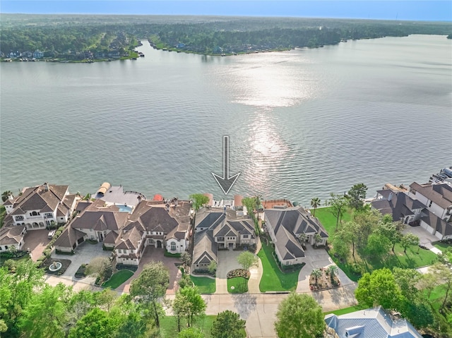 drone / aerial view with a residential view and a water view