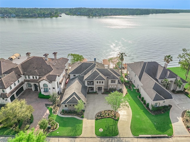 drone / aerial view with a residential view and a water view